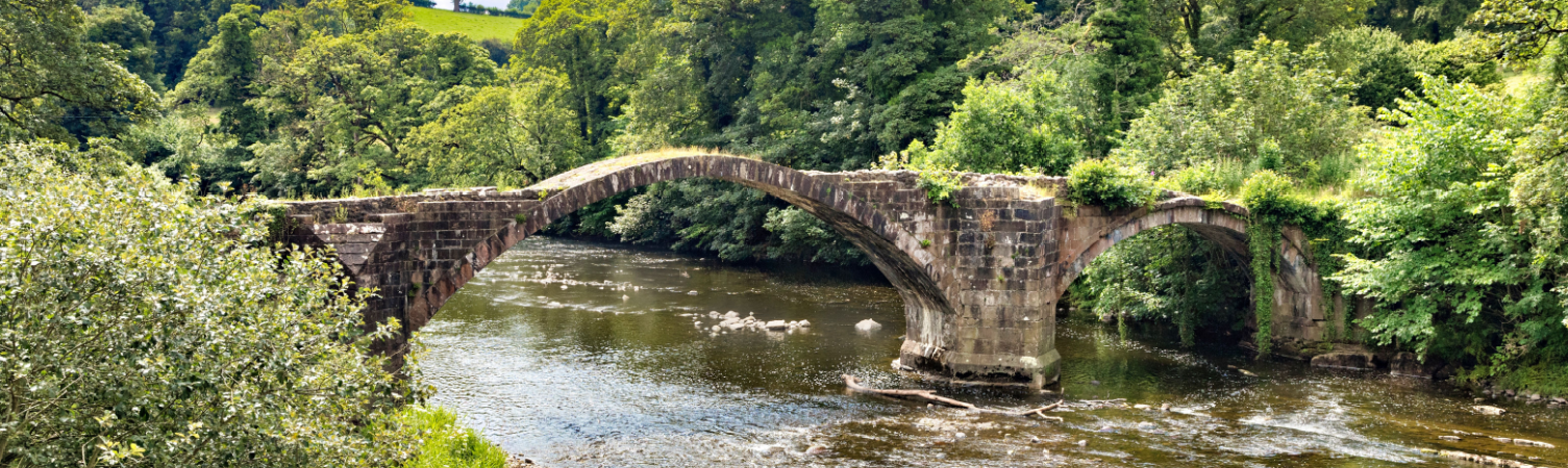 The historic Cromwell's Bridge in the Trough of Bowland, Lancashire, UK, now disused.