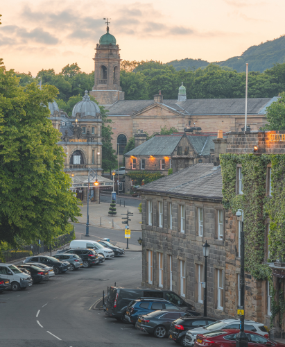 View over the main square in the historic market town of Buxton, Derbyshire, England with Old Hall Hotel, Opera House and St John's Church.