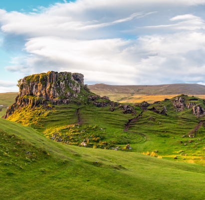 Panorama of famous mystic Fairy Glen at sunset, a green valley with romantic landscapes.