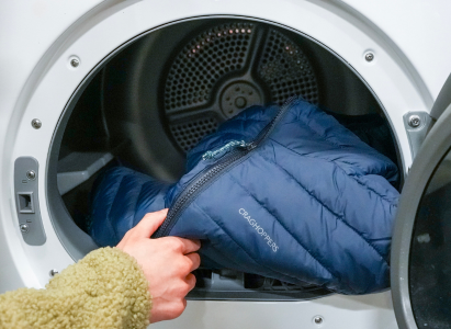 Putting the puffer jacket into the washing machine