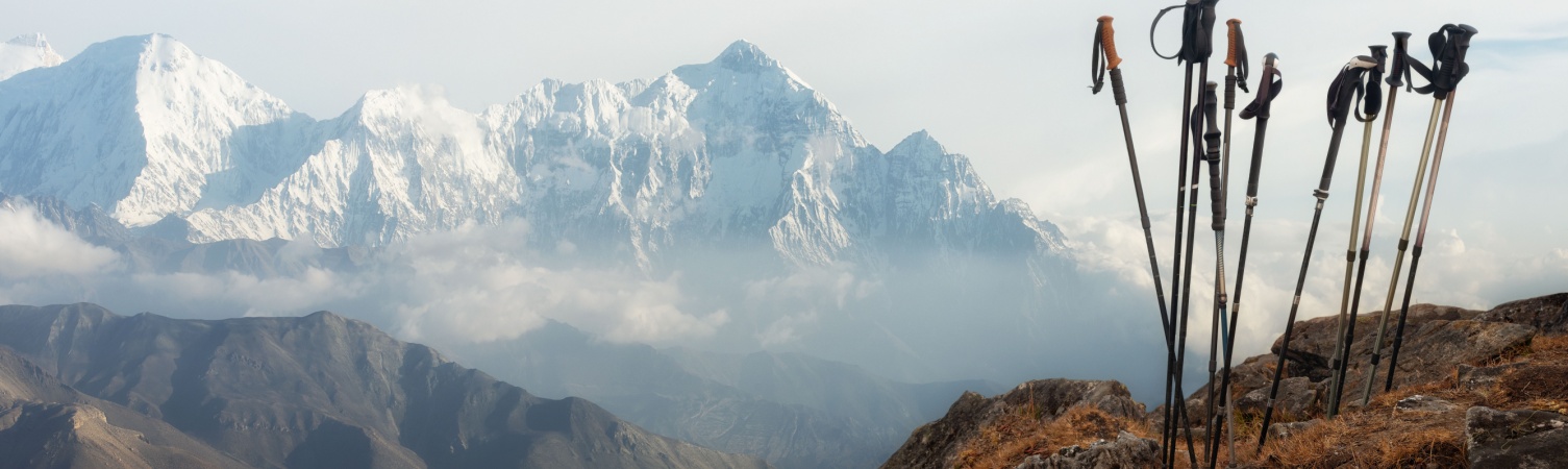 Group of trekking sticks on background mountains range in Himalaya