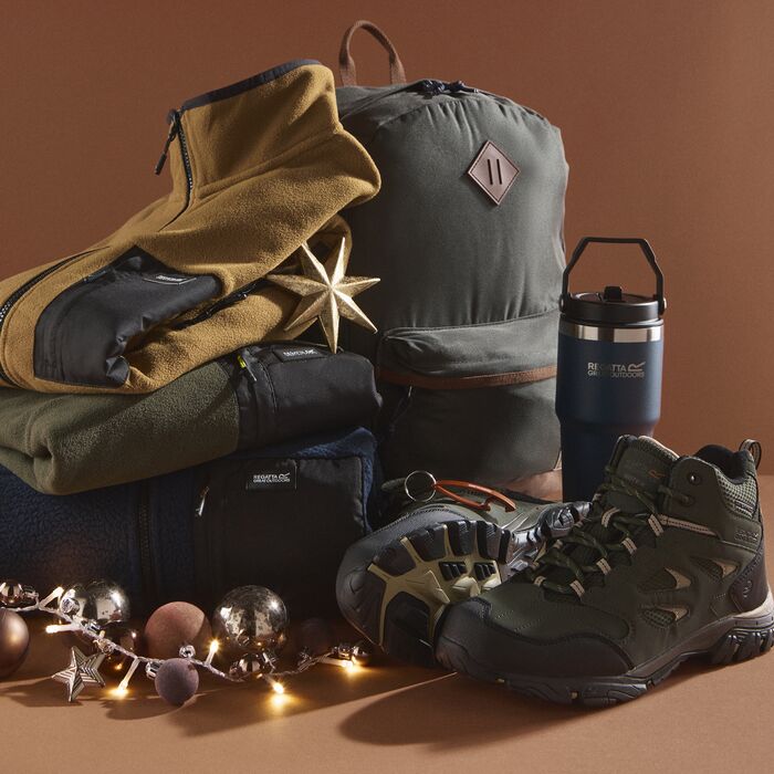 A man wearing Regatta clothing holding some Christmas presents