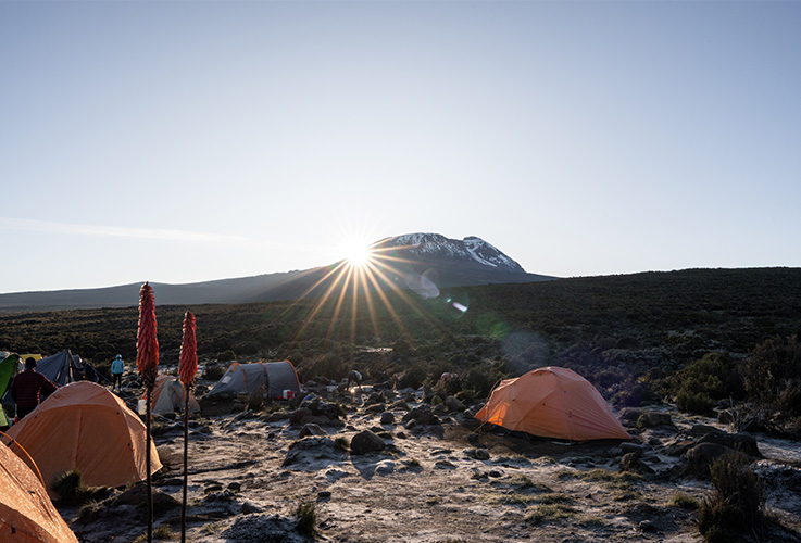 Camp site with tents on top of a mountain