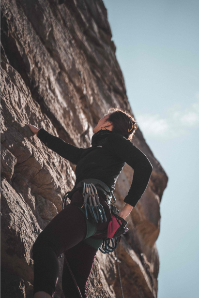 Rock climber setting piton