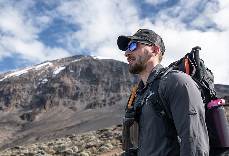 Hiking man on top of a mountain