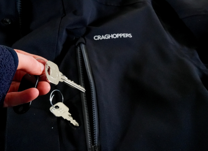 Removing items, keys, from the waterproof jacket pockets