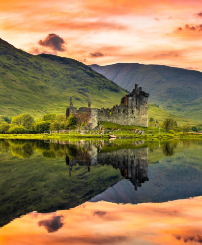 The ruins of Kilchurn castle at sunset on Loch Awe, the longest fresh water loch in Scotland