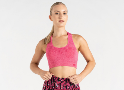 Woman wearing pink dare 2b sports bra 