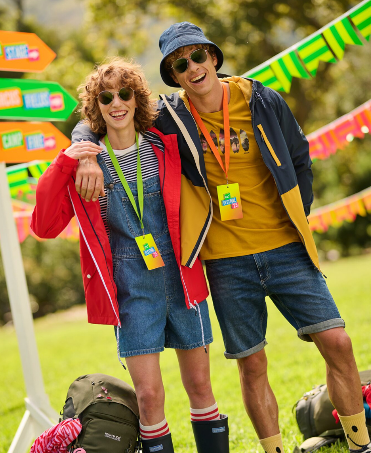 A man and a woman at a music festival wearing Regatta outdoor clothing