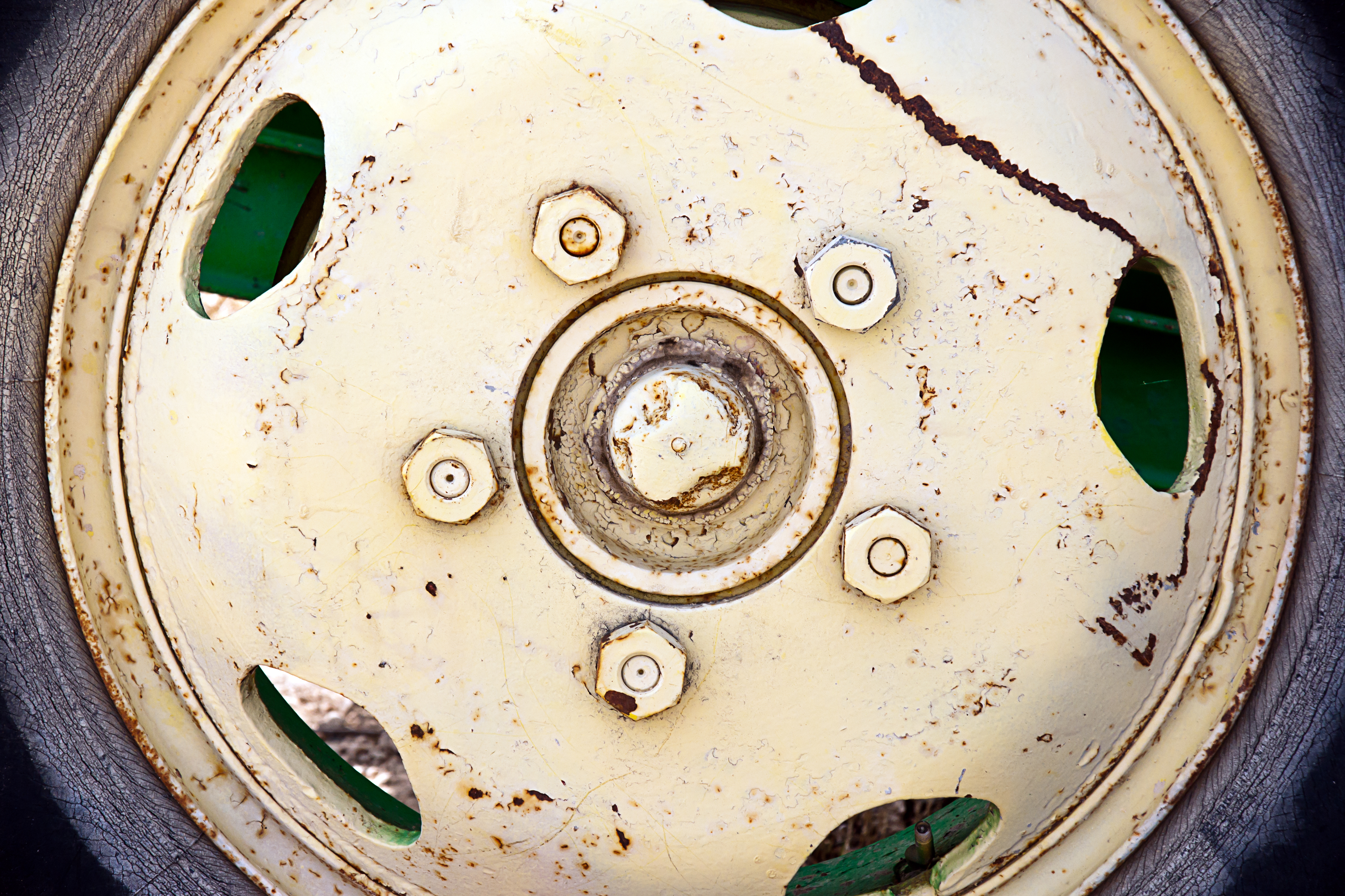 Closeup shot of old cracked rusty wheel metal