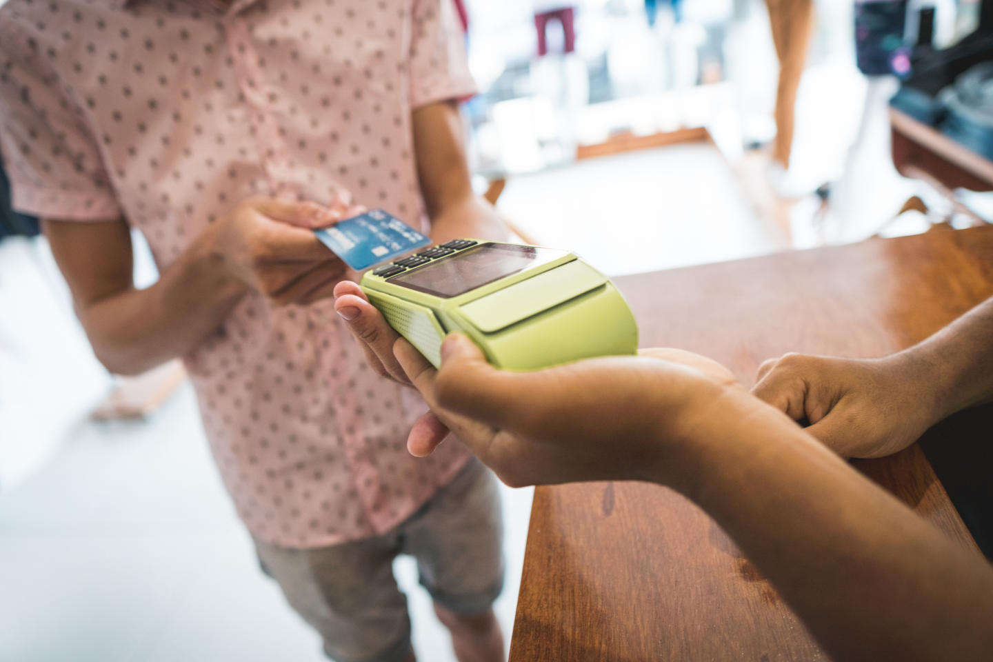 Person using debit machine 

