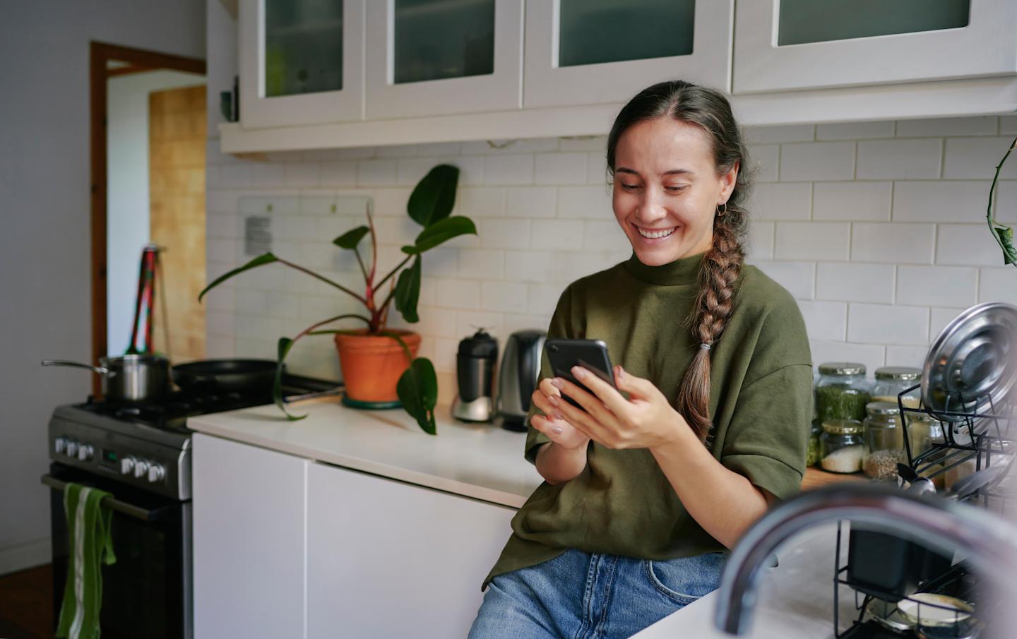 A person swiping through a dating app on a smartphone.

