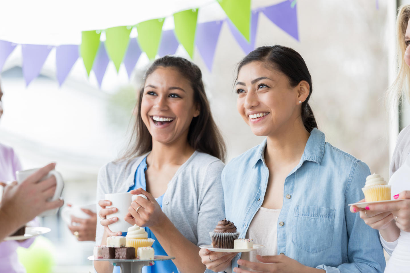 Two women celebrating at a birthday party