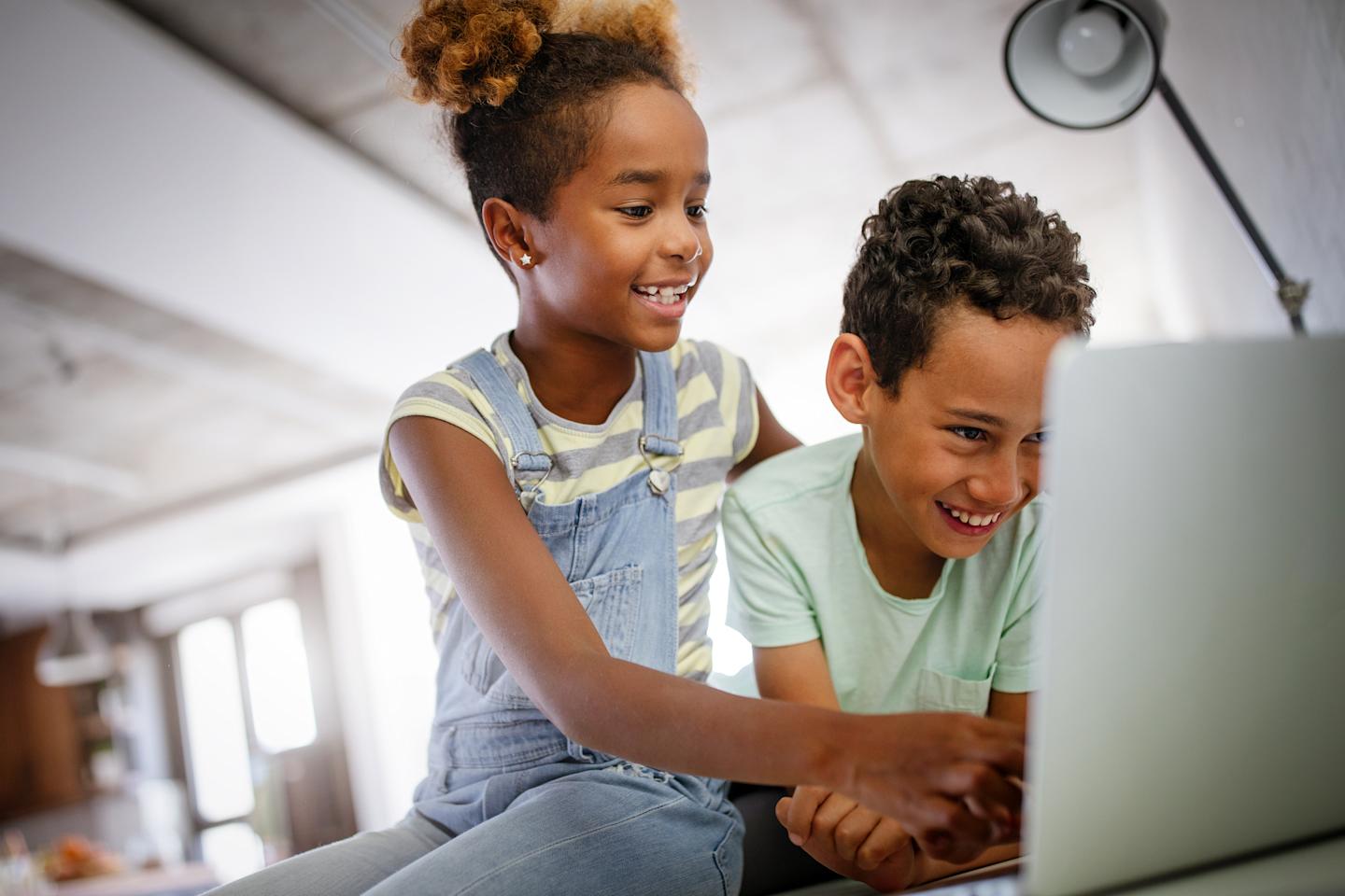 Two kids playing games online.