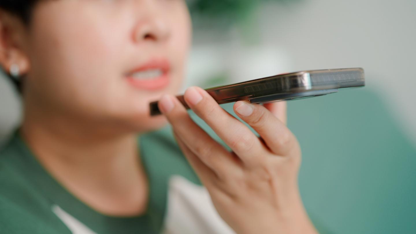 A person speaking to ChatGPT on their smartphone.

