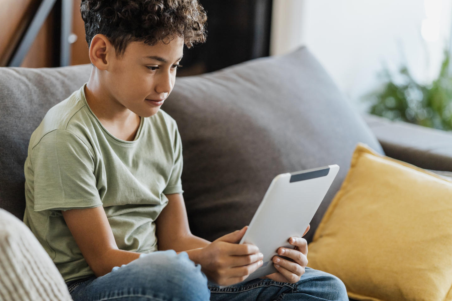 Child watching videos on a tablet 

