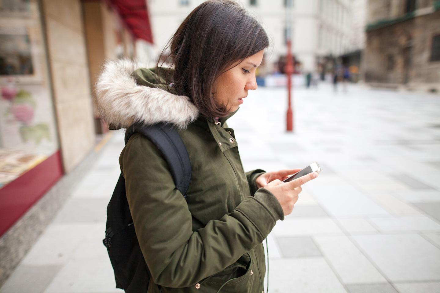  A person looking at their smartphone

