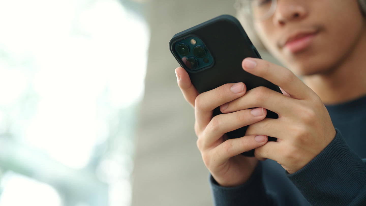 Teenager using smartphone