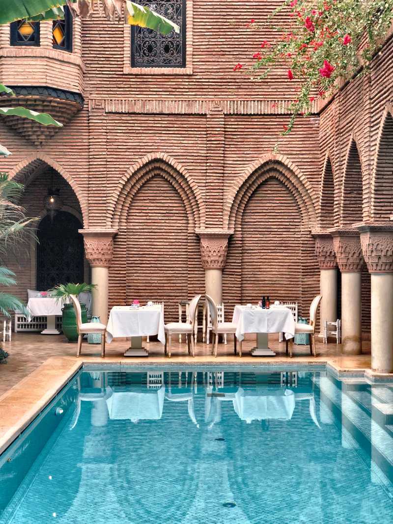 Table set next to a pool in Marrakech