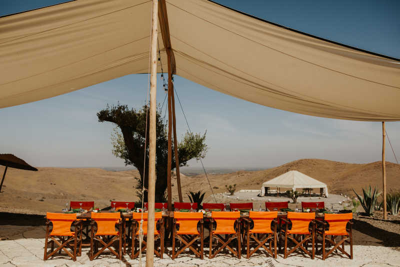 Lunch table setup under a tent in the Marrakech desert