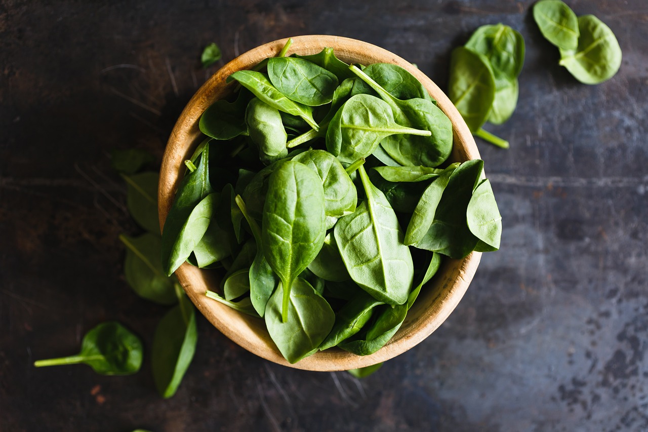 spinach on a wooden background.