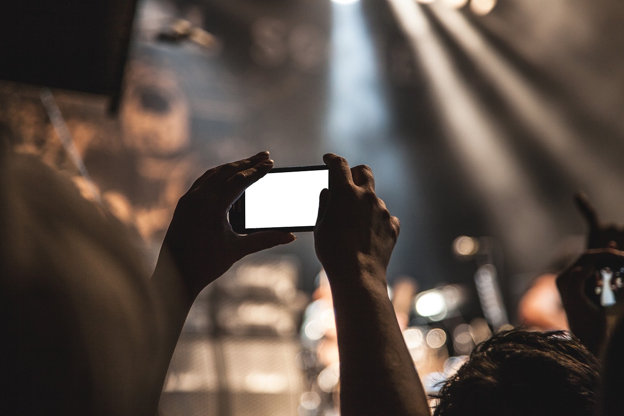 a photographer taking pictures of a concert.