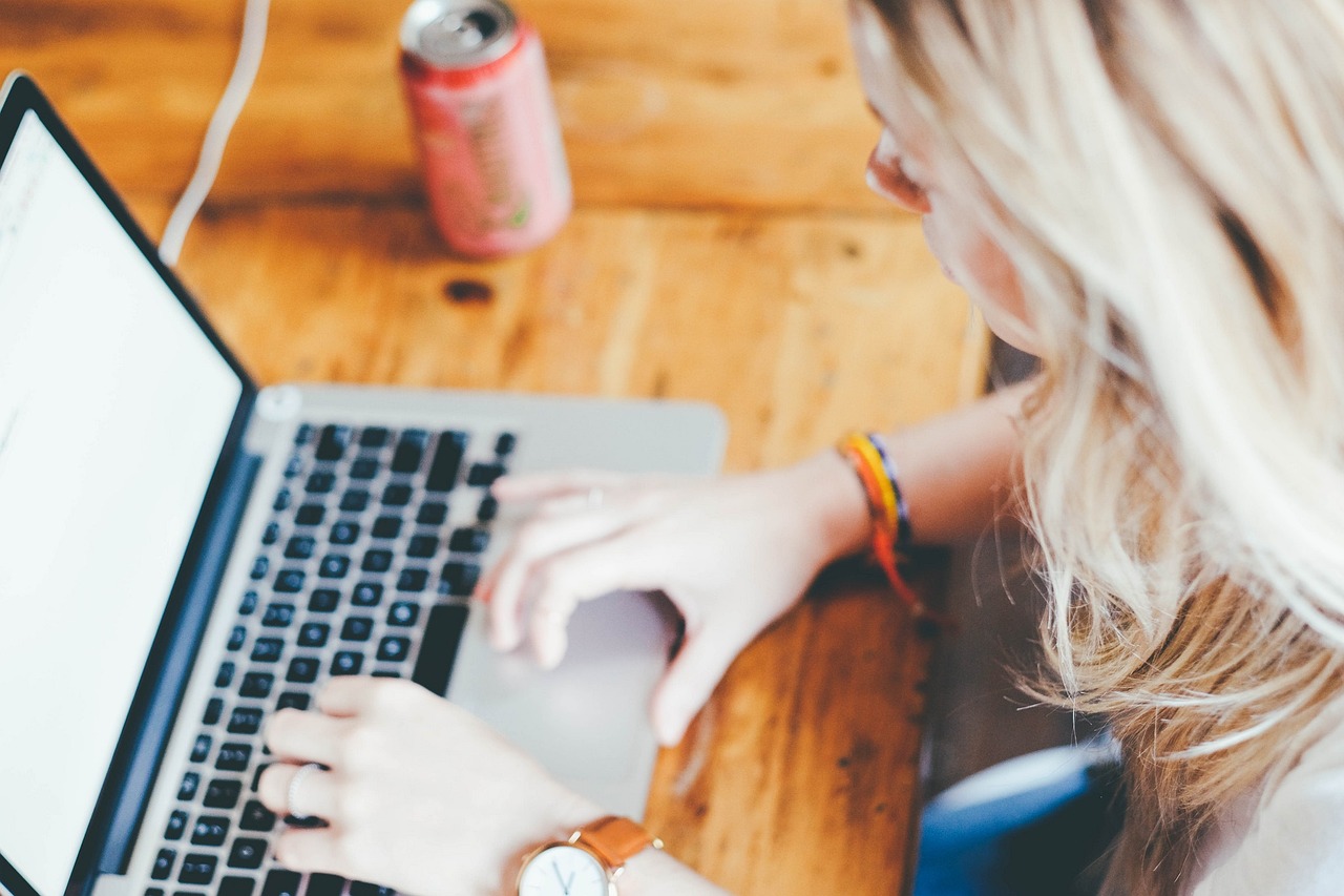 a woman working on a laptop.