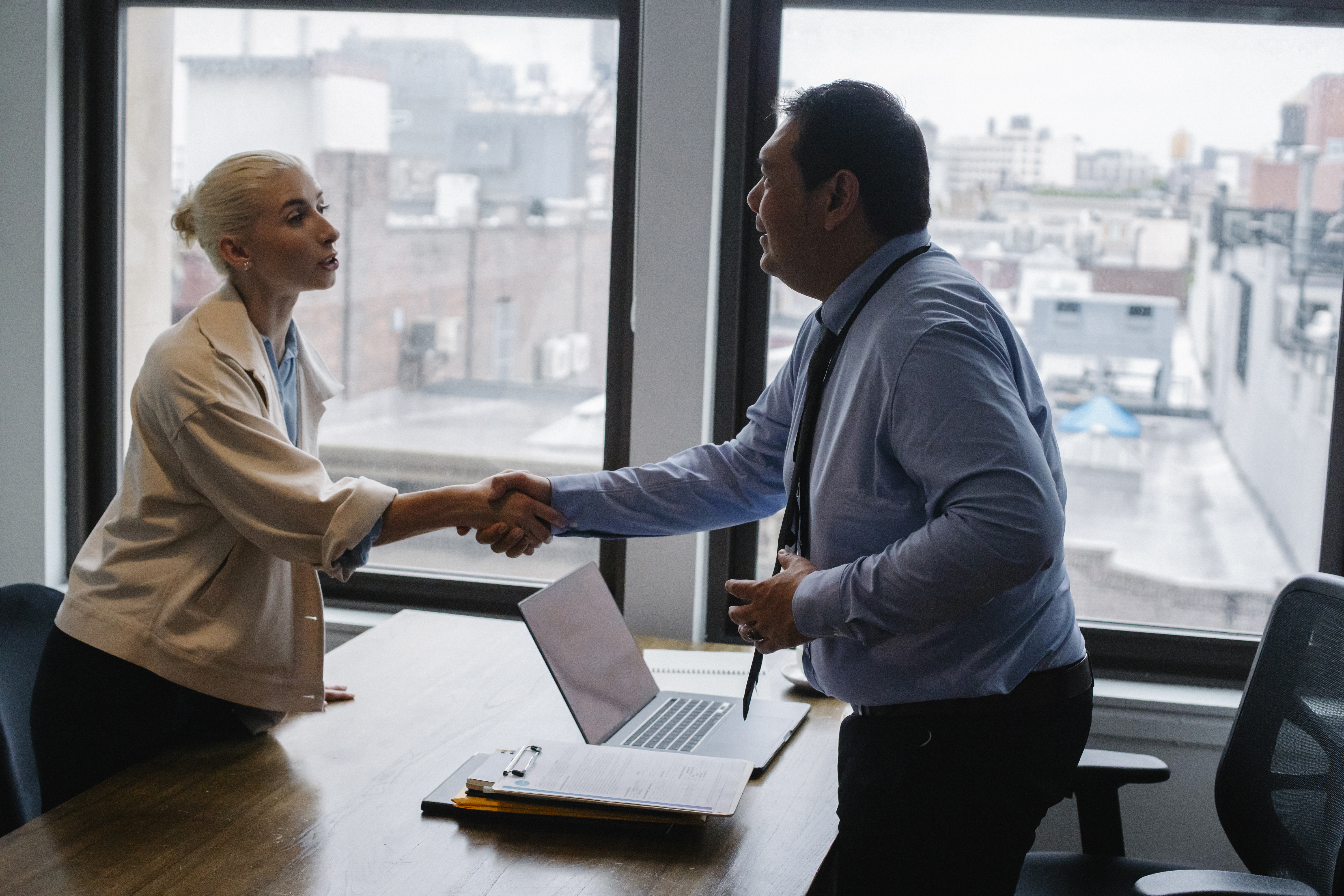 business people shaking hands in the office.