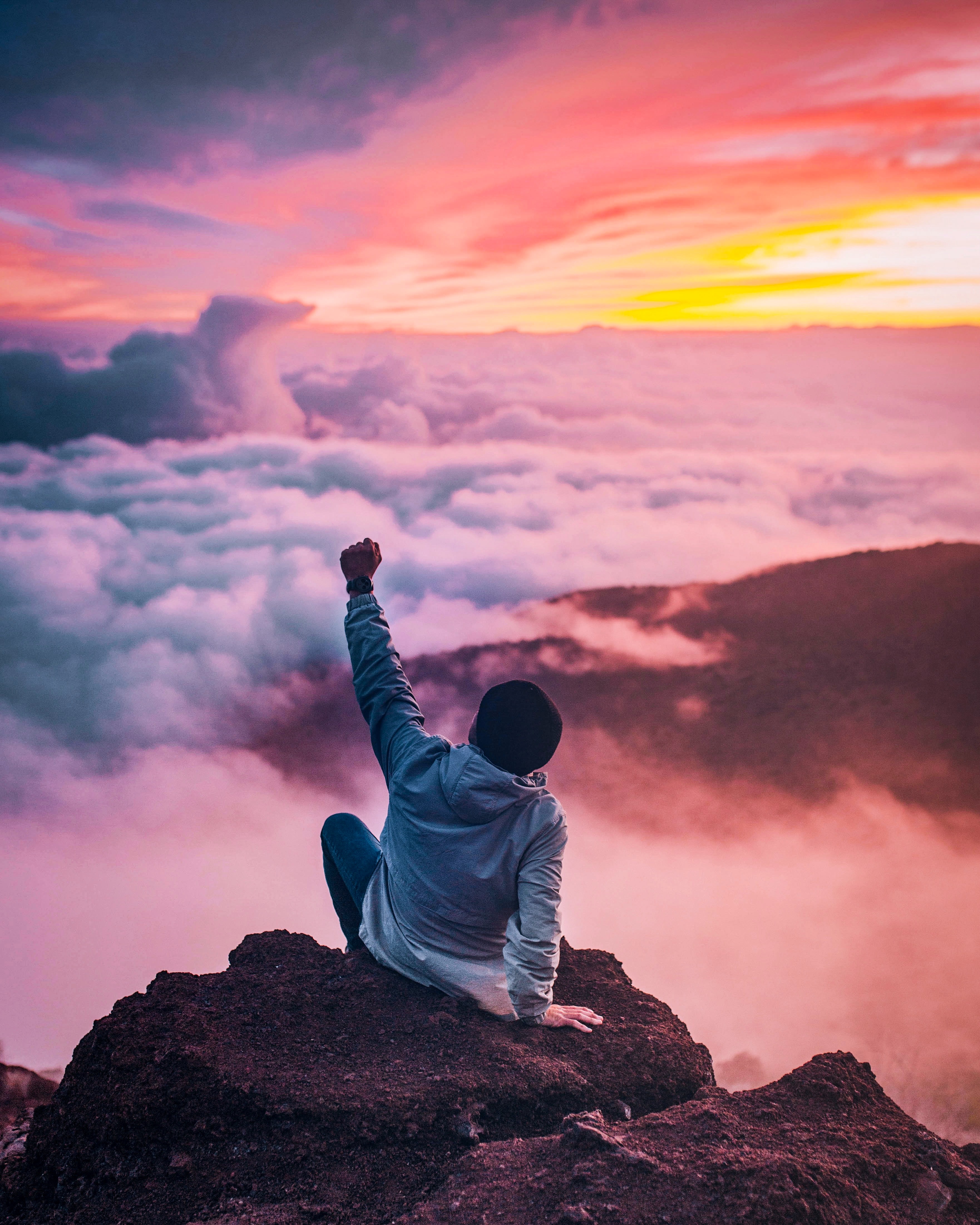 man standing on top of the mountain.