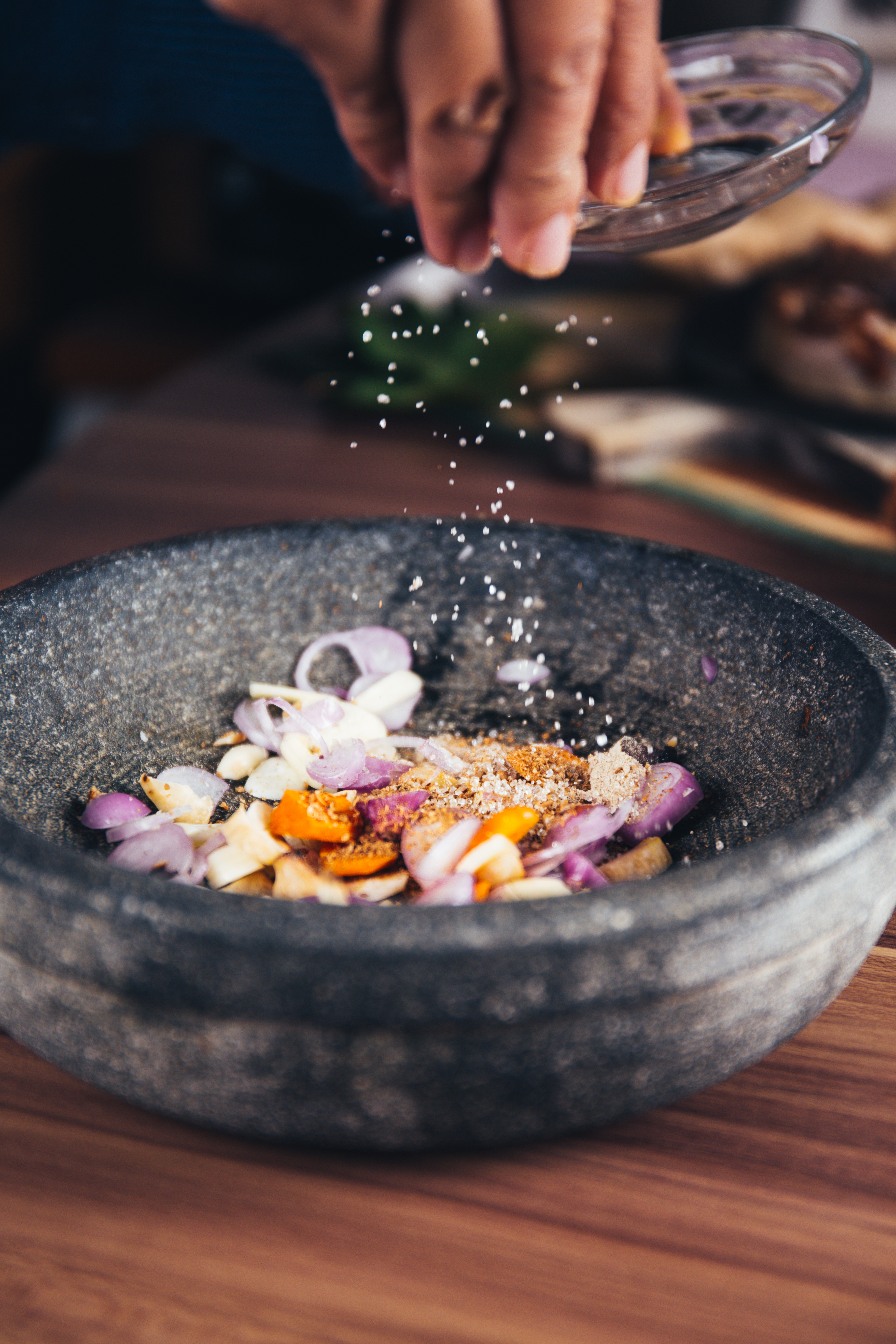 a bowl of fresh herbs and spices.