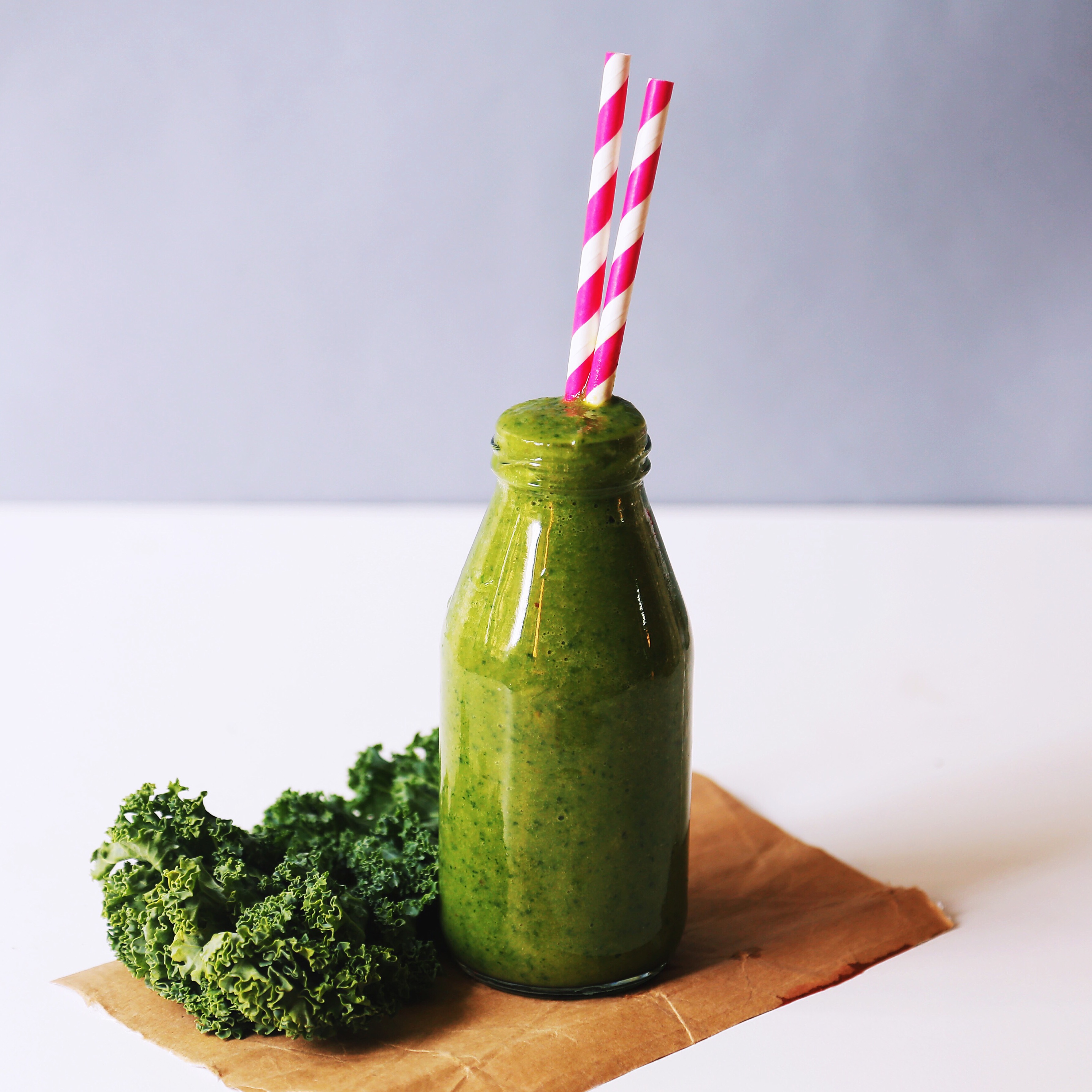 green smoothie with a bottle of water.