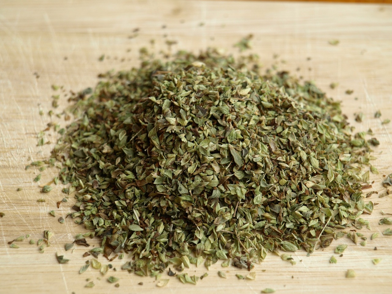 biological species leaves on a wooden cutting board.