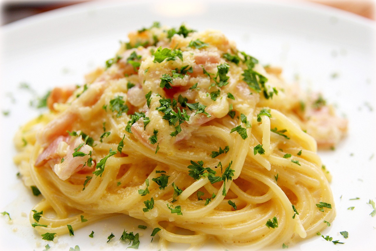 a dish of pasta with a tomato sauce.