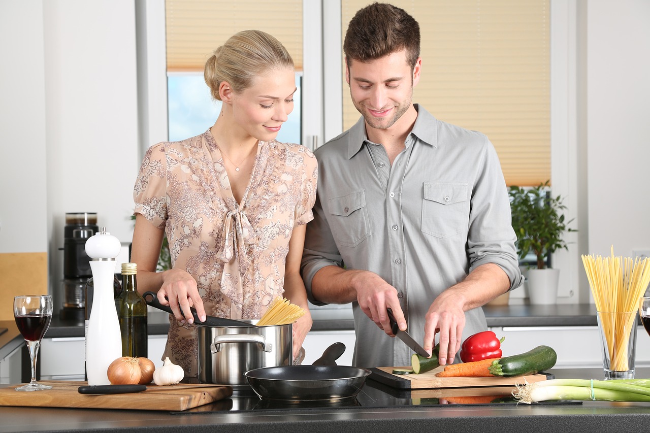 couple cooking together in the kitchen.