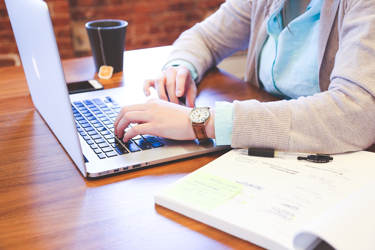 a woman working at a desk.