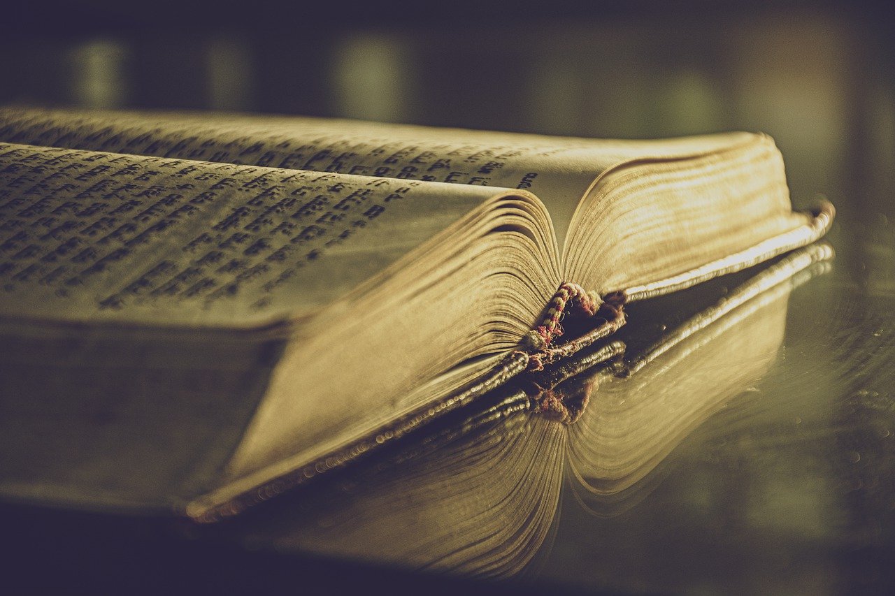 poetry book on a wooden table.