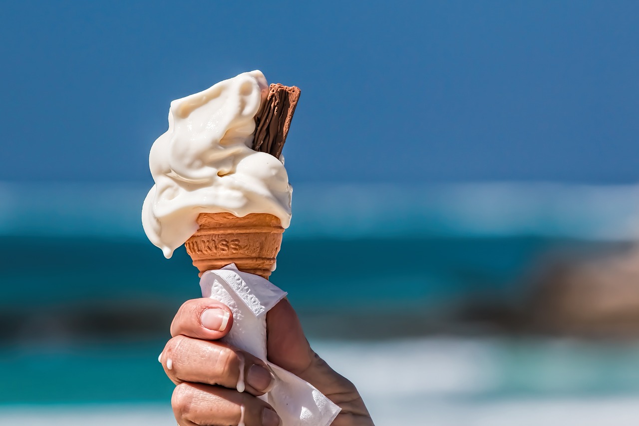 hand holding a piece of ice cream.