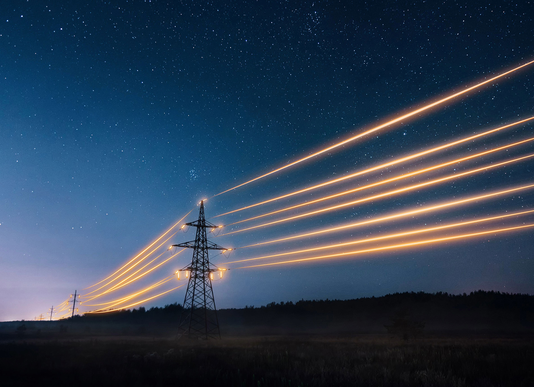 Electricity transmission towers with orange glowing wires the starry night sky. Energy infrastructure concept.