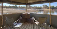 Zebras and elephants from floating hide, Boteti River, Botswana.