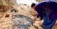 Sand bread preparation, Morocco.