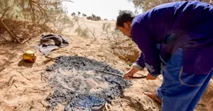 Sand bread preparation, Morocco.