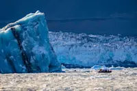 Guests on Zodiac cruise, Romer Fjord, Greenland.