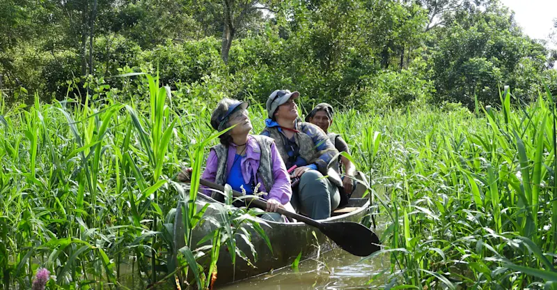 Earthwatch guests canoeing, Amazon, Peru.