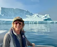 Heading to base camp by boat, the world feels more remote every minute, in Greenland. 