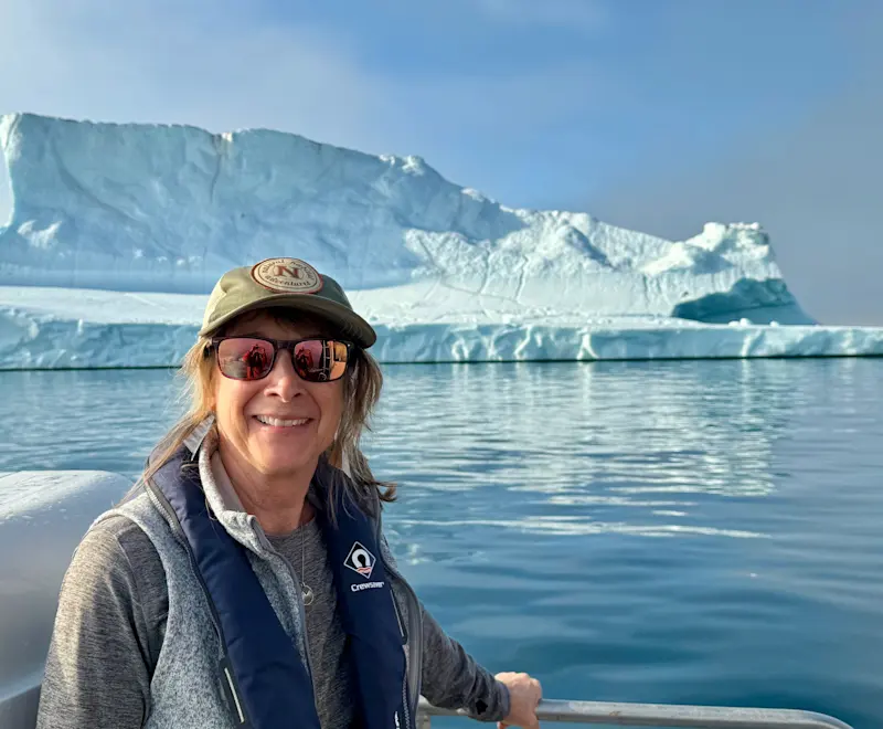 Heading to base camp by boat, the world feels more remote every minute, in Greenland. 