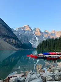 Admiring the stunning Moraine Lake in Alberta, Canada.