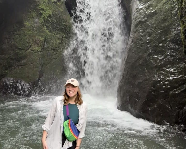 Cooling off beside a stunning waterfall in Ecuador.