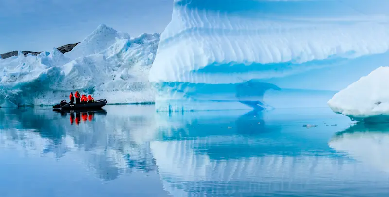 Nat Hab guests on Zodiac ride, Sermilik Fjord, Greenland.