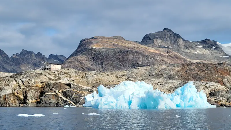Kayaking through icebergs, East Greenland.