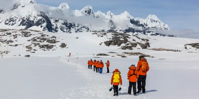 Hiking to a penguin colony at Weincke Island, Antarctica.